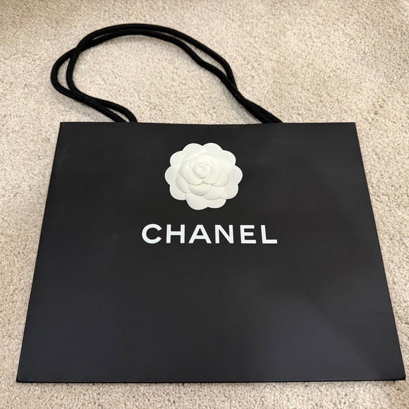 CHANEL Black Paper Bag with White Floral Detail - Picture 1 of 6